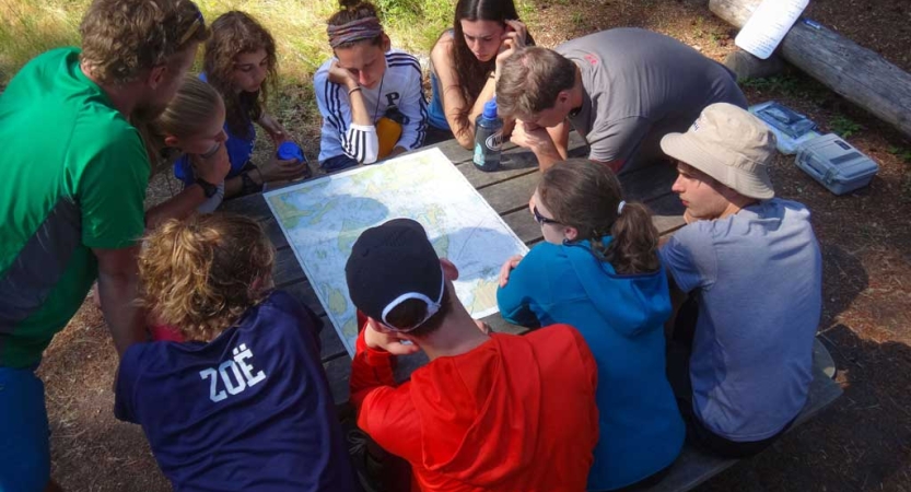 teens learn navigation skills on backpacking trip